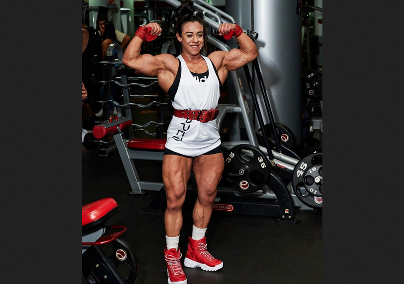 Female bodybuilder biceps, triceps, delts-shoulders, forearms, chest, working