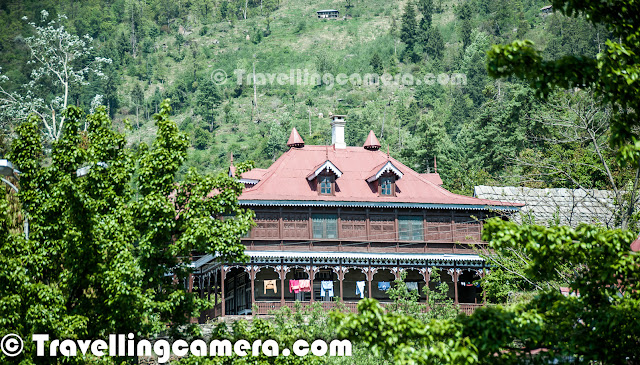 When we were planning our trip to Kinnaur, a visit to Sarahan was also planned. Before starting from Delhi we had researched enough about places we should not miss when visiting a town or village on the way. But still many things surprised us and this Rajmahal just behind Bhimakali Temple was one of them. This Photo Journey is trying to share some moments spent around this Rajmahal with huge campus near the famous Bhimakali Temple in Sarahan town of Shimla district in Himachal Pradesh.Architecture of this Rajmahal was almost similar to one which we saw in Rampur, Shimla.  We visited Sarahan next day after exploring Rampur and Jeori. If you have missed our old post on Ramapur Kingdom, just check it out at - http://phototravelings.blogspot.com/2013/05/rajmahal-at-rampur-bushahr-in-shimla.htmlUsually people know Sarahan because of Bhimakali Temple and folks are hardly worried about this huge campus. But above view caught our attention and these huge houses made us explore possibilities to go there and see. Initially people were hesitant about telling that property belongs to Raja Virbhadra Singh, but gradually we got to know. While having snacks in the market, someone told us that visitors are also allowed inside this campus. He guided us through the main gate where we requested the gate-keeper. He allowed us to go inside and see some of these huge complexesAs we entered, there was a very well maintained road connecting all Apple orchards & houses. First we crossed few apple trees on boths sides and then there was a gate on right which was a direct entry for Bhimakali Temple. Bhimakali Temple has two main entries, one is from main market and other is from this Rajmahal campus. If you haven't checked our Photo Journey on Bhimakali Temple, check it out at - http://phototravelings.blogspot.com/2013/05/bheemakali-temple-sarahan-town-shimla.htAs we moved close to these huge buildings, we noticed that some families were living there. We didn't ask much but it seems, these were families of folks who were taking care of this whole campus full of Apple Orchards, different buildings and few small temples as well.At the end of this internal road, there is a huge building which was probably the largest one among all. This was named as 'Shrikhand View'. Above photograph shows one of the main gates for this building. Initially we were hesitating to enter inside this building but staff there was quite welcoming and they guided us through the whole building.There is a huge lawn around this building and above photograph is clicked form lawn only. Photograph shows view of hills above the main Rajmahal. The very first photograph of this Photo Journey shows this great lawn with main Rajmahal building in the background.This whole campus is surrounded by Pine forests. In fact whole Sarahan town is mainly surrounded by Pine and Apple Trees :)Sarahan Palace was alos capital pf former princely state of Bushair for several centuries. Sarahan is famous for it's legends, hilly architecture, special culture and amazing beauty of nature all aroundIt's on hill top and there is a deep valley next to it which ends at Satluj River. One can see snow covered peaks of Shirkhand mountains and that is why one of the main Palace is known as Shirkhand View PalaceSummer capital of Rampur Bushahr which is one of the biggest princely states in the Shimla region is mainly popular for Bhimkali Temple. Sarahan presents striking spectacle of snow-covered Himalayan ranges and a picture of unspoilt pastoral loveliness. It beholds the construction technic of more than 800 years old and also gives a good opportunity to study the western Himalayan architecture.Shrikhand view has a huge campus and many rooms attached to it. It seems, some of the rooms have not been opened for many years. Some of them have very old styled locks and chains.With its two multi-tiered sanctuary ters, elegantly sloping slate-tiled roofs, and gleaming golden spires, Sarahan Palace & Bhimakali Temple are few of the most majestic of the few early timber architectures left in the Sutlej Valley... This is an area renowned for its unusual tradition of housing holy shrines on raised wooden platforms.Following page has some nice details about Sarahan Town, Bhimakali Temple and Sarahan Palace - http://www.trancehimalaya.info/p/sarahan.htmlNotice these chains and locks, which are still in use at Sarahan Palace. There are some small temples inside the Palace as wellThese huge seating areas in Placae balconies are really royalBhimakali Temple was made at the order of Raja Shamsher Singh in the mid-nineteenth century. The sanctum also contains a fabulous collection of Hindu as well as Buddhist bronzesOne of the most interesting structures of the timber-bonded style is Raja Bushahr Palace cum Temple Complex which has been described as one of the finest specimens of hilly architecture. Almost 2000 years old, and like all buildings of the hill type, it is built of layers of rubble masonry and beams of cedar wood A View of Bhimakali Temple from Sarahan Palace and few apple trees can be seen on the foreground