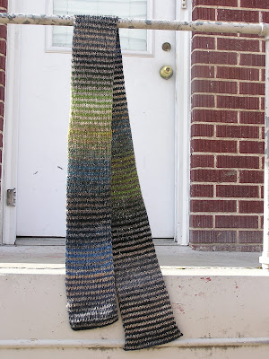 striped scarf hanging in front of a doorway