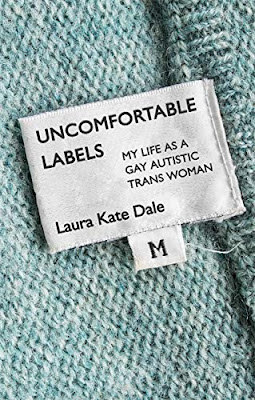 A blue sweater with a clothing tag that says Uncomfortable Labels