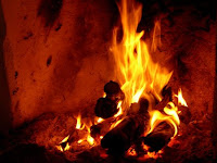 A brightly burning fire in a fireplace