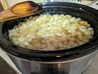 Cubed lard in a crock pot, melting down