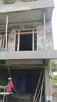 Teak frame erected while constructing the wall