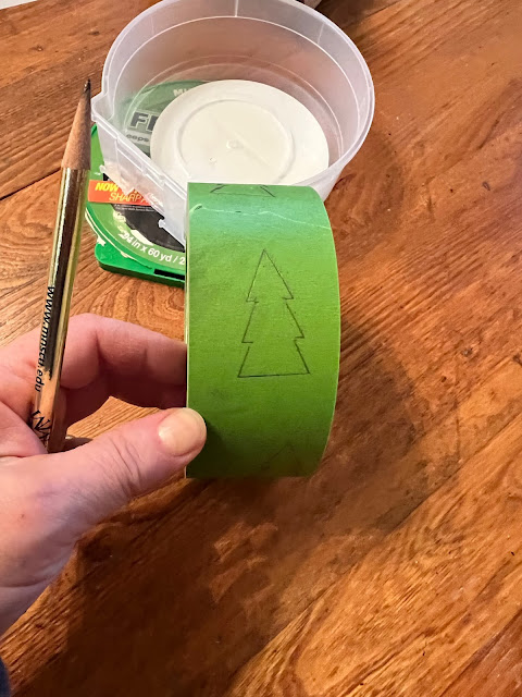 Photo of a tree stencil traced onto Frog Tape.