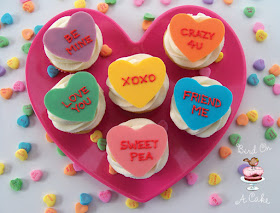 http://birdonacake.blogspot.com/2012/01/conversation-heart-cupcake-toppers.html