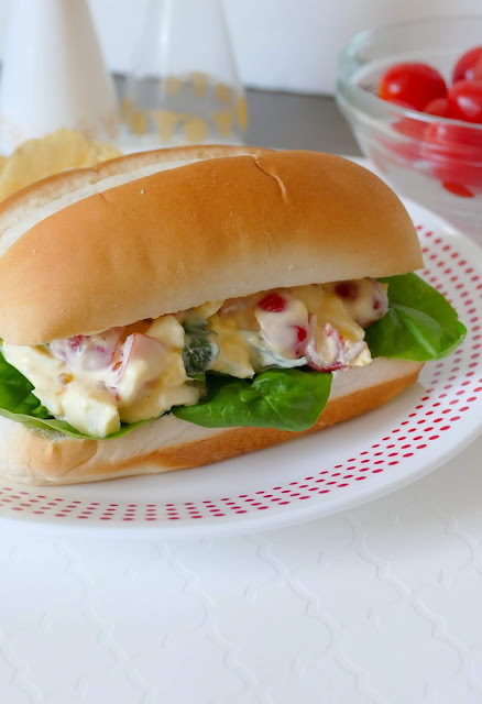 This egg salad sandwich is a perfect lunch when served with soup, fruit, chips or veggies! The tomato basil flavor is unique and so delicious! Serve on bread, wraps, buns, croissants or baguettes!