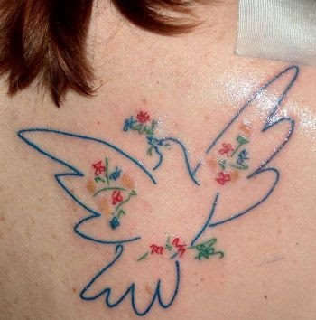 small tattoos of doves. Dove tattoo is marked on girl#39;s right lower back in the tattoo shop.