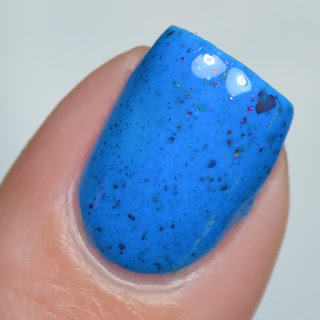 blue nail polish with flakies