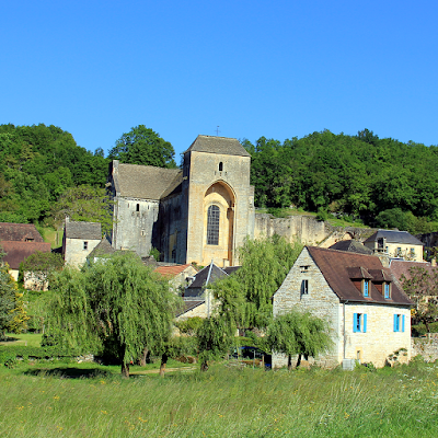 The fortified church dominates the village.