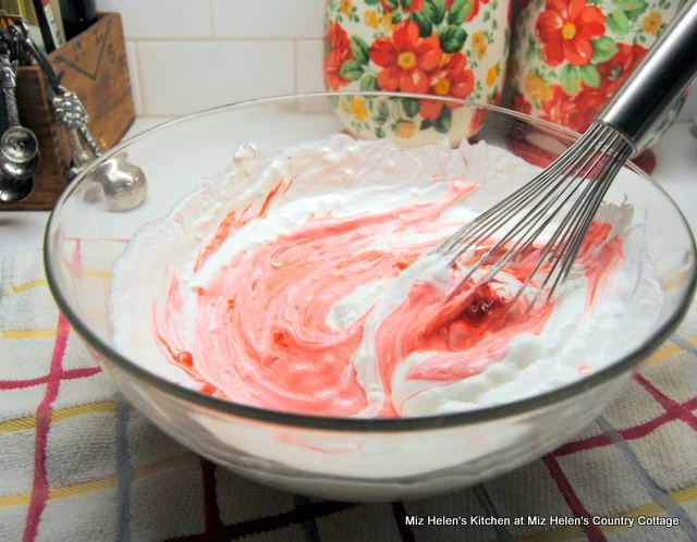 Raspberry Poke Cake With Marshmallow Frosting