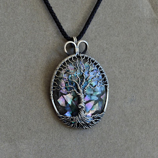 Gray Background: Silver Tree of Life Necklace Pendant With Glow in the Dark Mother of Pearl Orgonite