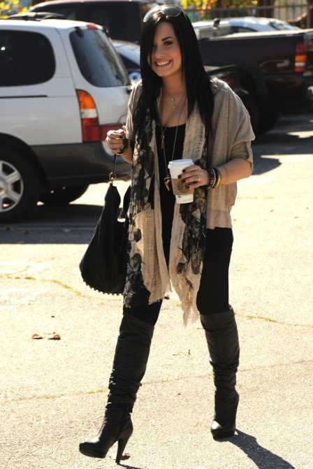 Demi Lovato sport big hoop earrings necklaces and kept her straight hair