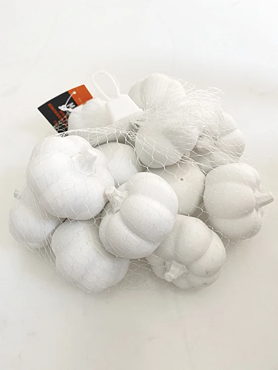 bag of white pumpkins