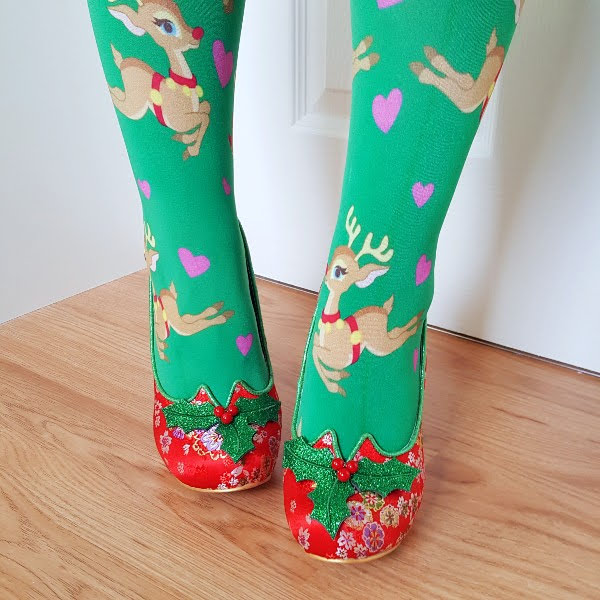 wearing green reindeer tights and red court shoes with sparkly holly