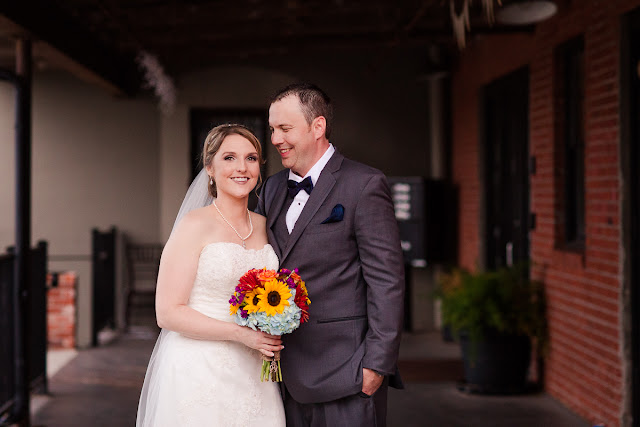 A pose during the formal portraits, but they make it look so natural.  He has just said something delightful to her, hence the authentic smiles, which I love.  Set at the Hall at the Railhouse located in Norman, OK during the fall of 2016.