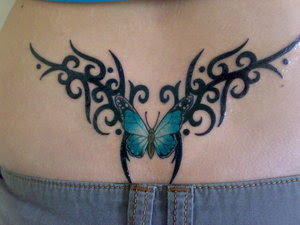 Butterfly with Tribal Tattoo Design on Female Lower Back