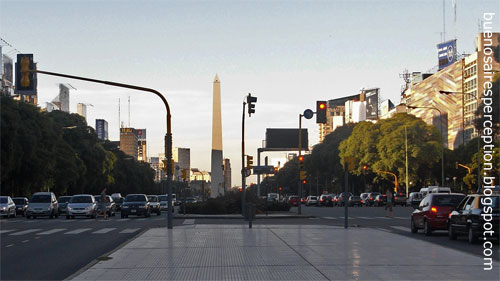 El Obelisco the center of the "Plaza de la República" (Republic Square) at the intersection of "Avenida Corrientes" and "Avenida 9 Julio", the world's biggest avenue, in Buenos Aires at sunset