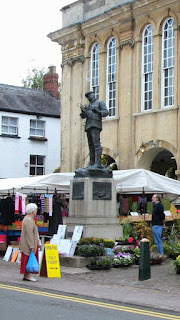 Statue of Charles Rolls amongst a 2006 Agincourt Square market , Monmouth