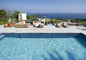 Large swimming pool with the terrace looking on the sea