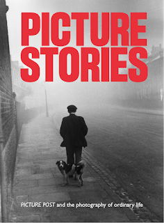 Picture Stories poster - b/w period photo of man in a flat cap walking away with dog looking at camera