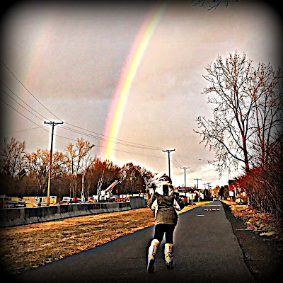 M.W. Bychowski with child under rainbow