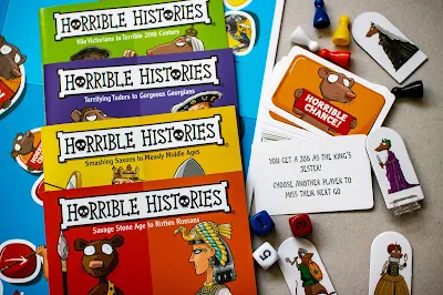 The contents of Horrible Histories, the Board Game including game pieces and questions