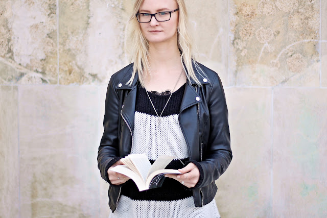 leather jacket and black and white oversized knit