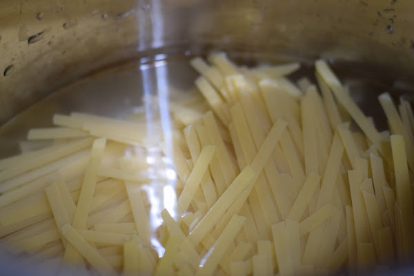 Pasta in the instant pot covered with water.