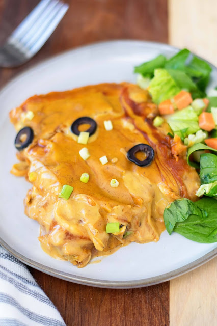 A piece of the vegan chicken-less tamale casserole with a salad on the side.