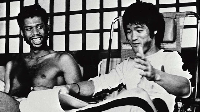 Bruce Lee with Kareem Abdul-Jabbar on stage in hollywood