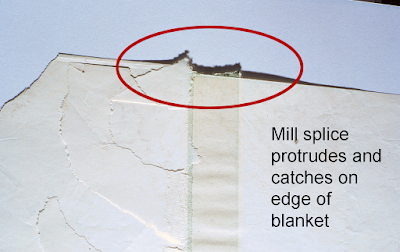 Splice tape sticks out past edge.