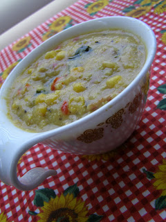 Maque Choux Soup in vintage handled cup on red checkered sunflower table cloth