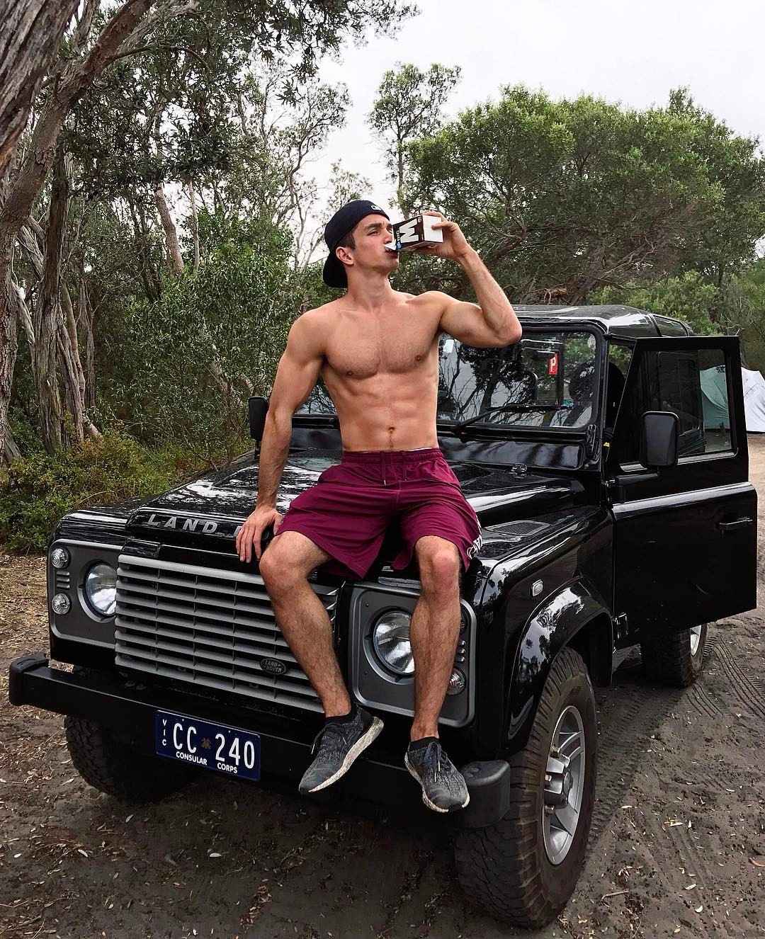 fit-shirtless-sexy-young-skinny-guy-sitting-car-drinking-cocky-college-bad-boy-hairy-legs-chest-hair