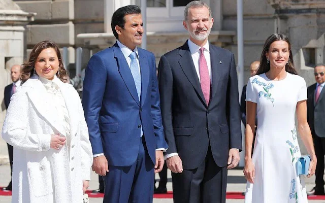 Queen Letizia wore a white Aline embroidered short sleeve dress by Carolina Herrera. Sheikha Jawaher Bint Hamad Bin Suhaim