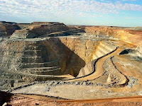 Hard rock gold mining in a pit.