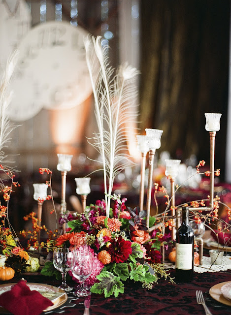 We had white Peacock feathers Up close of my copper candelabras