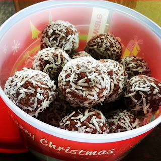 Rum Balls in a red Container. From Christmas rum balls easy recipie