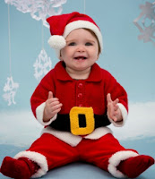 http://www.redheart.com/free-patterns/santa-baby-suit
