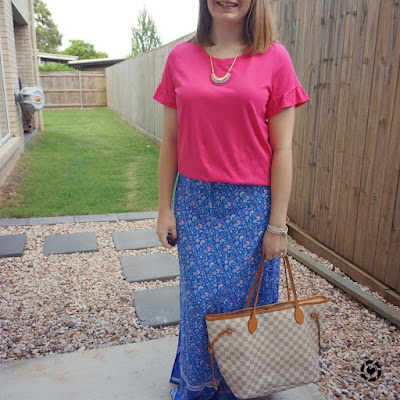 awayfromblue Instagram | bright colourfum summer SAHM outfit with floral maxi skirt and fuchsia pink statement sleeve tee