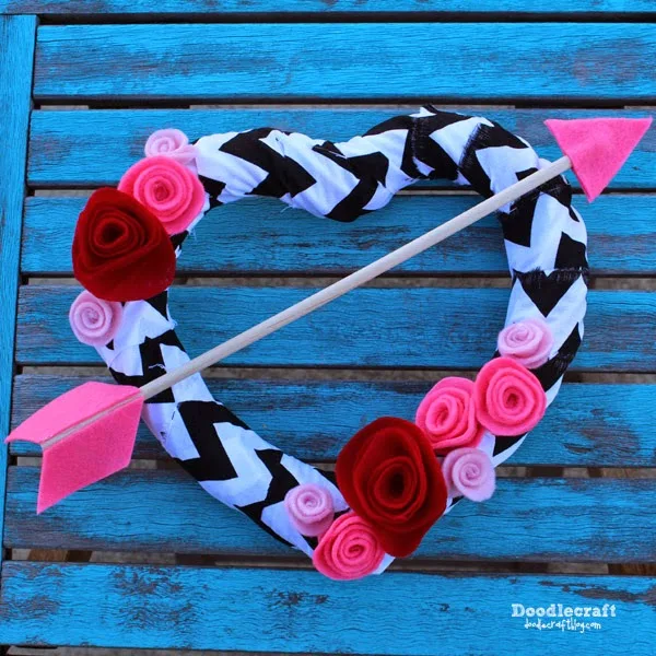 http://www.doodlecraftblog.com/2015/01/valentine-arrow-through-heart-wreath.html