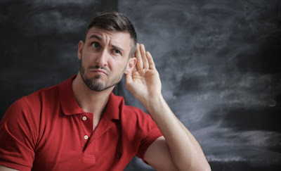 A man showing that he is listening