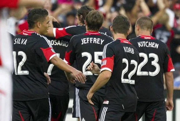 Dwayne De Rosario celebrates his goal against Toronto FC with D.C. United teammates