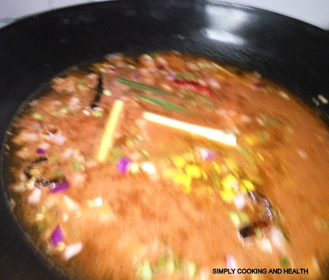 Add curry powder, chili powder and add water.