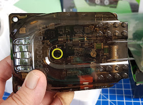 Robobloq Q-Scout brain is transparent plastic, showing wiring and circuitry