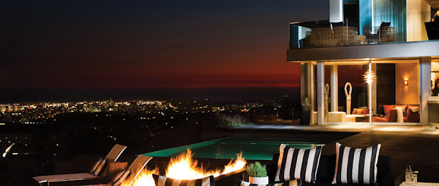 Picture of the swimming pool and the city lights in the background