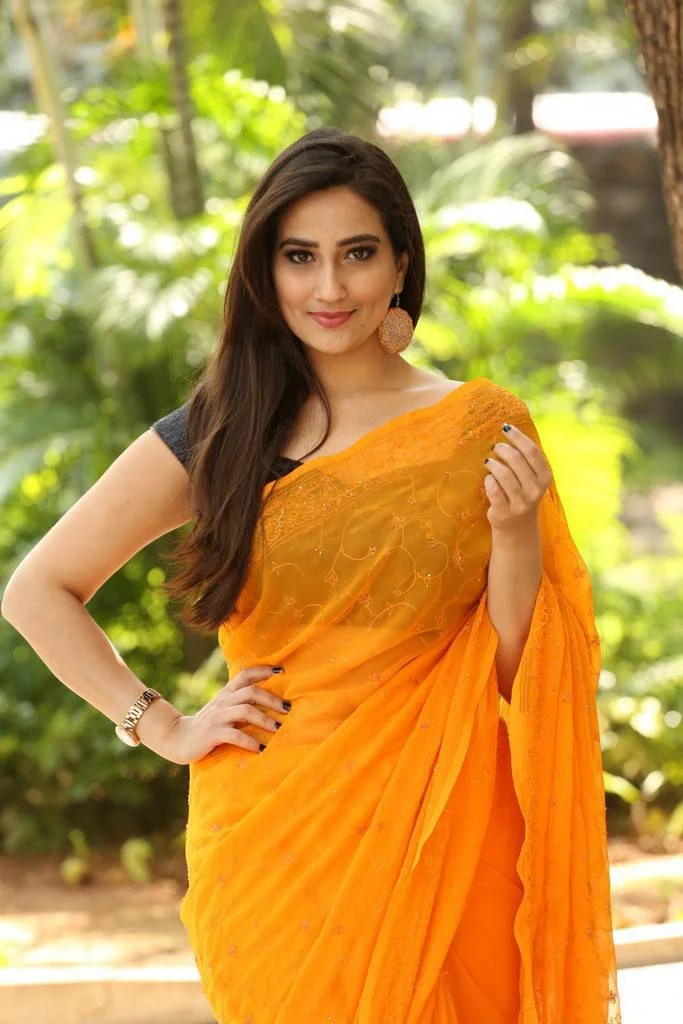 Telugu TV Anchor Manjusha Photoshoot In Transparent Yellow Saree