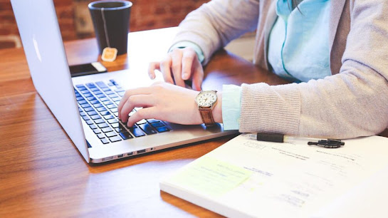 eCommerce marketer at work on a computer.