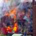 Building destroyed in an explosion of color (Video)