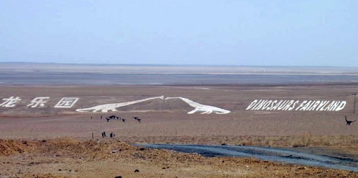 North of China on the Sino-Mongolian border, near the town of Erenhot (also known as Erlian), you will find the statues of two towering Brontosauruses. The two dinosaurs are located on either side of the main highway, their long necks stretching to the other, until the two dinosaur's mouth meet as if to share a kiss. Each dinosaur statue is 34 meters wide and 19 meters high. The span of the two together reaches 80 meters. The ground near the kissing couple is littered with many dozen smaller statues of dinosaurs of all shapes and sizes.