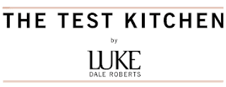 The Test Kitchen / logo / https://winedineandplay.blogspot.com/2014/01/the-test-kitchen.html